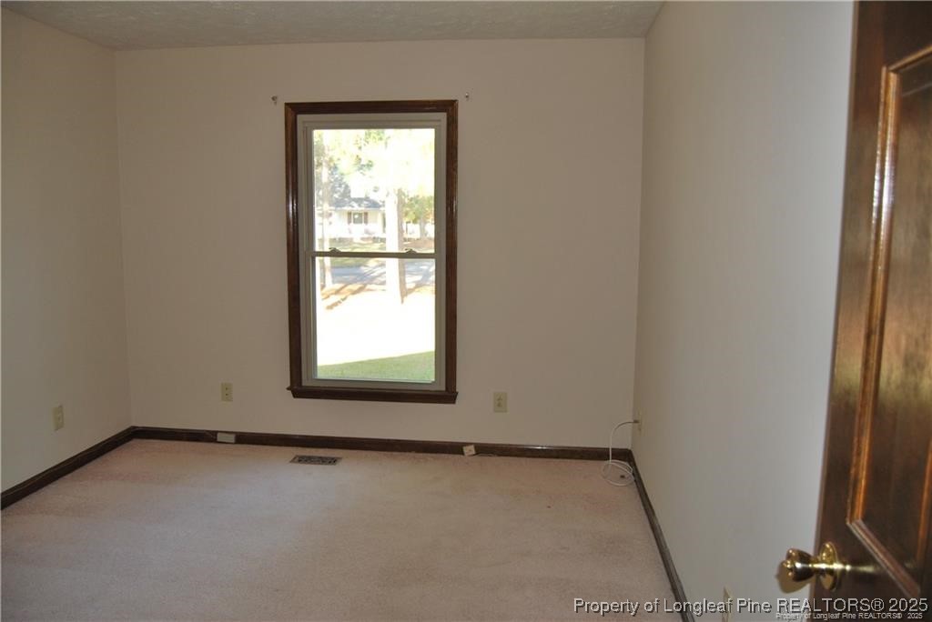 7794 Privet Court Fayetteville, NC 28311 - Photo 17 of 19 a view of an empty room and a window