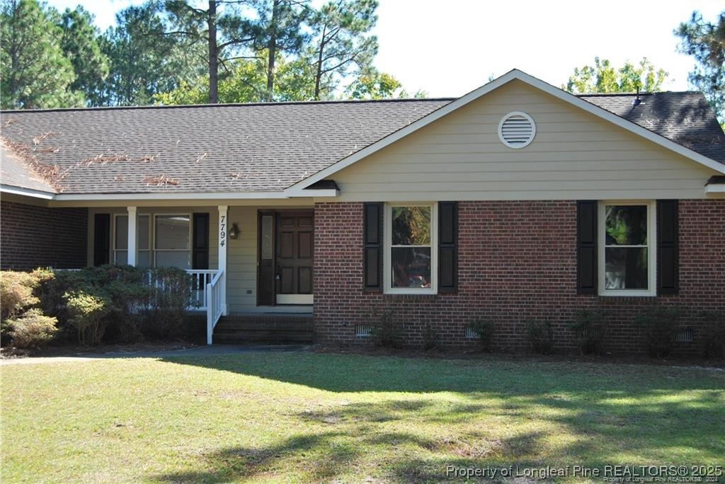 7794 Privet Court Fayetteville, NC 28311 - Photo 2 of 19 a house view with a garden space