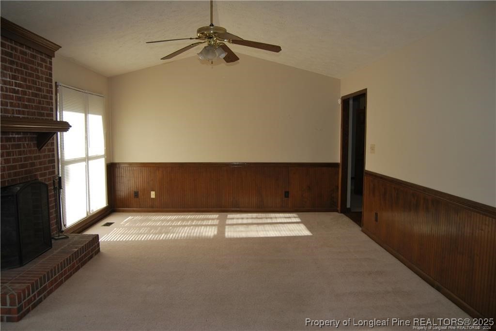 7794 Privet Court Fayetteville, NC 28311 - Photo 4 of 19 a view of an empty room with a fireplace