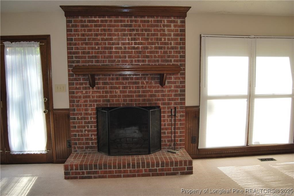 7794 Privet Court Fayetteville, NC 28311 - Photo 5 of 19 a living room with furniture and a fireplace