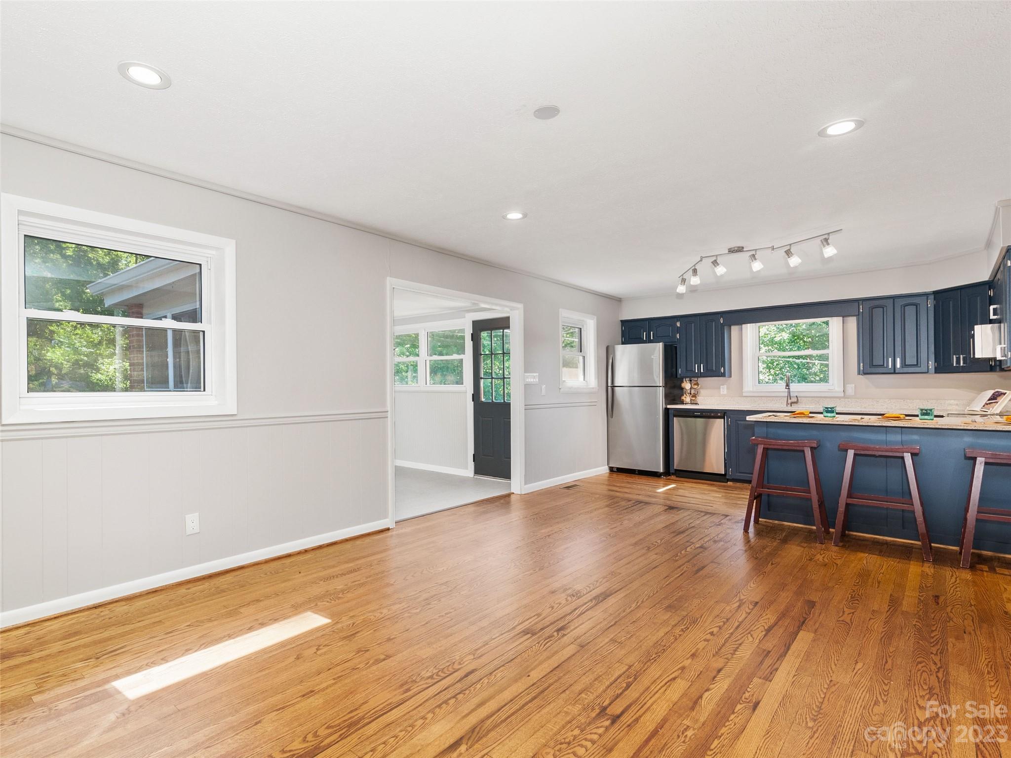 79 Oak Street Clyde, NC 28721 - Photo 9 of 23 a view of an empty room with kitchen and window