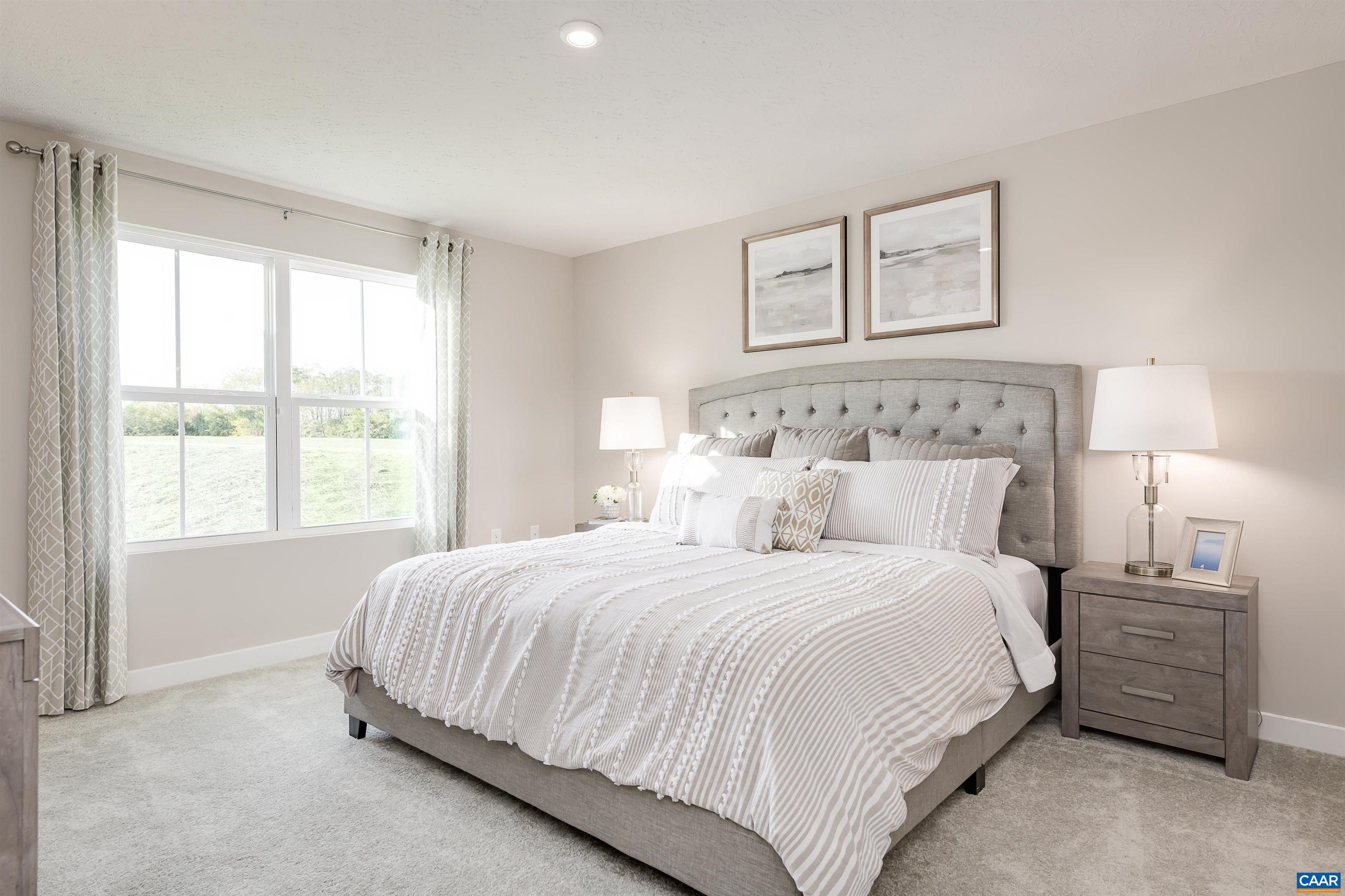 5159 Lazy Branch Lane Keswick, VA 22947 - Photo 7 of 17 a bedroom with a bed and a lamp