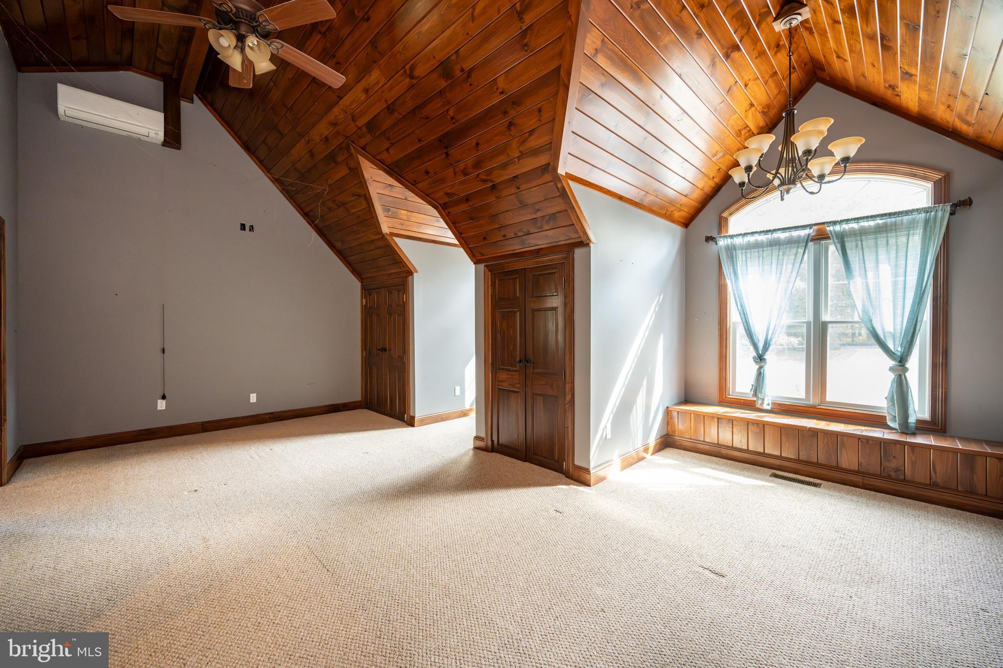 1909 Pysell Crosscut Road Oakland, MD 21550 - Photo 33 of 82 a view of an empty room with a fireplace and windows