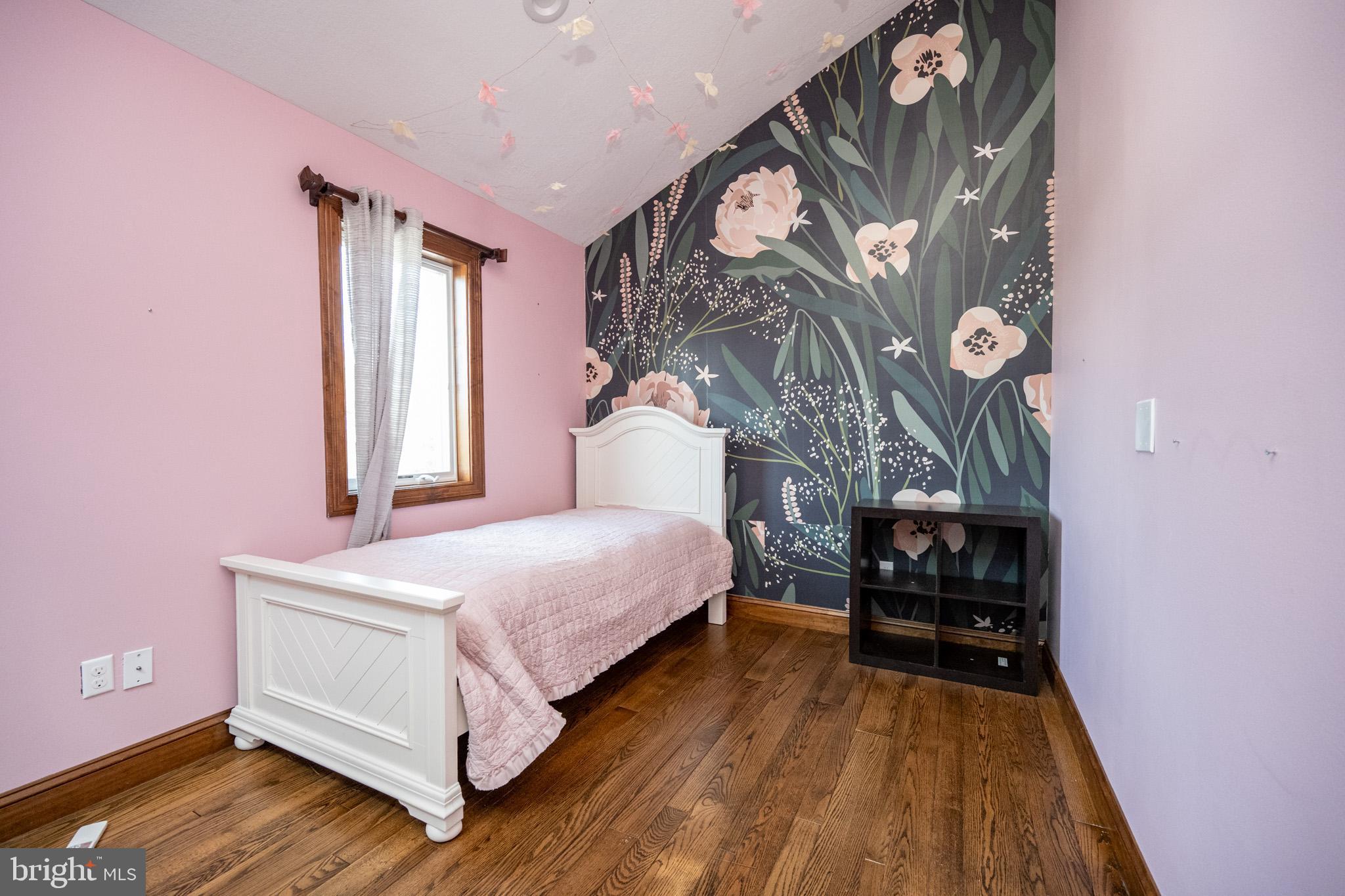 1909 Pysell Crosscut Road Oakland, MD 21550 - Photo 52 of 82 a bedroom with a bed and a chandelier