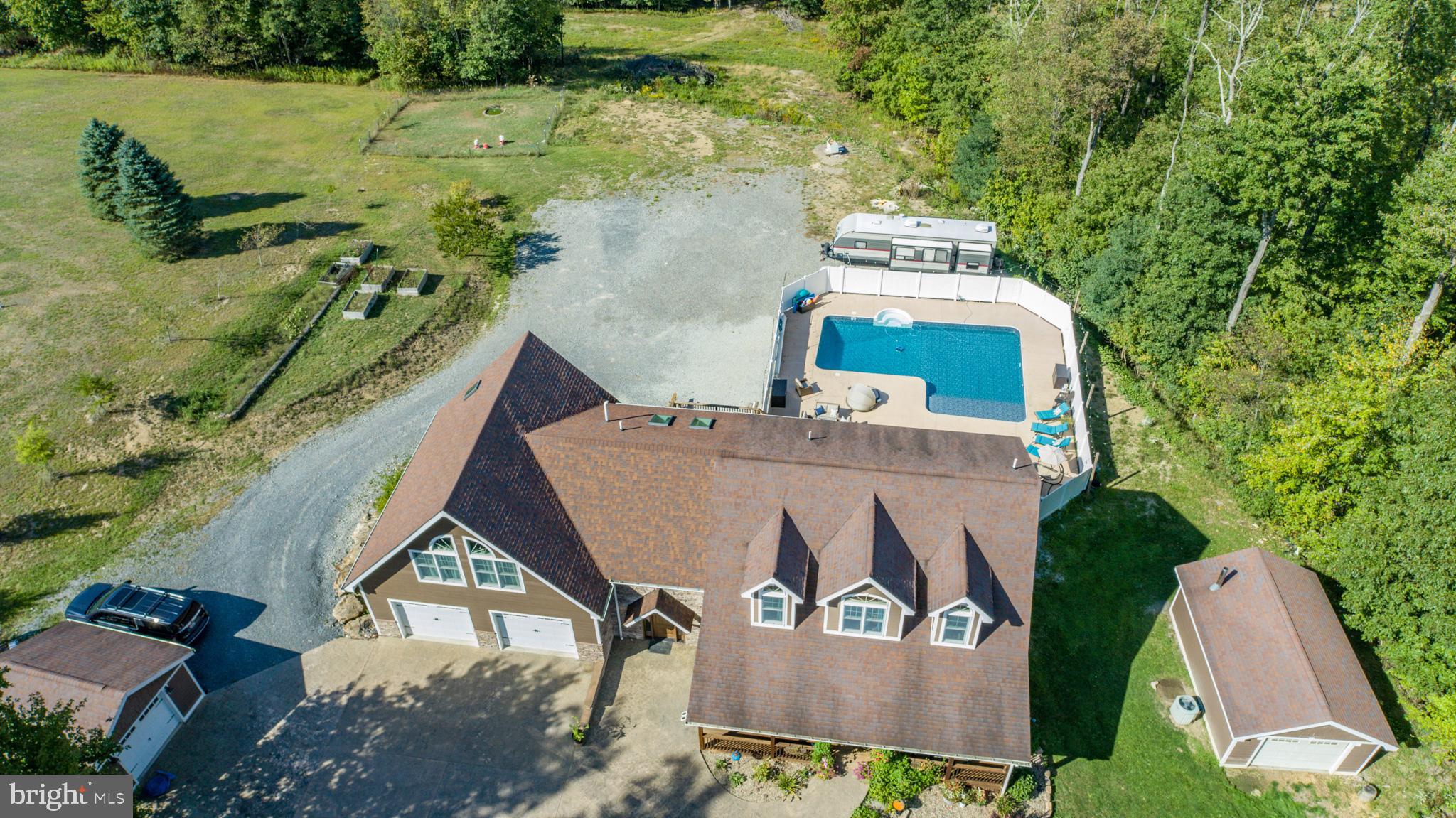 1909 Pysell Crosscut Road Oakland, MD 21550 - Photo 79 of 82 an aerial view of a house with outdoor space and lake view
