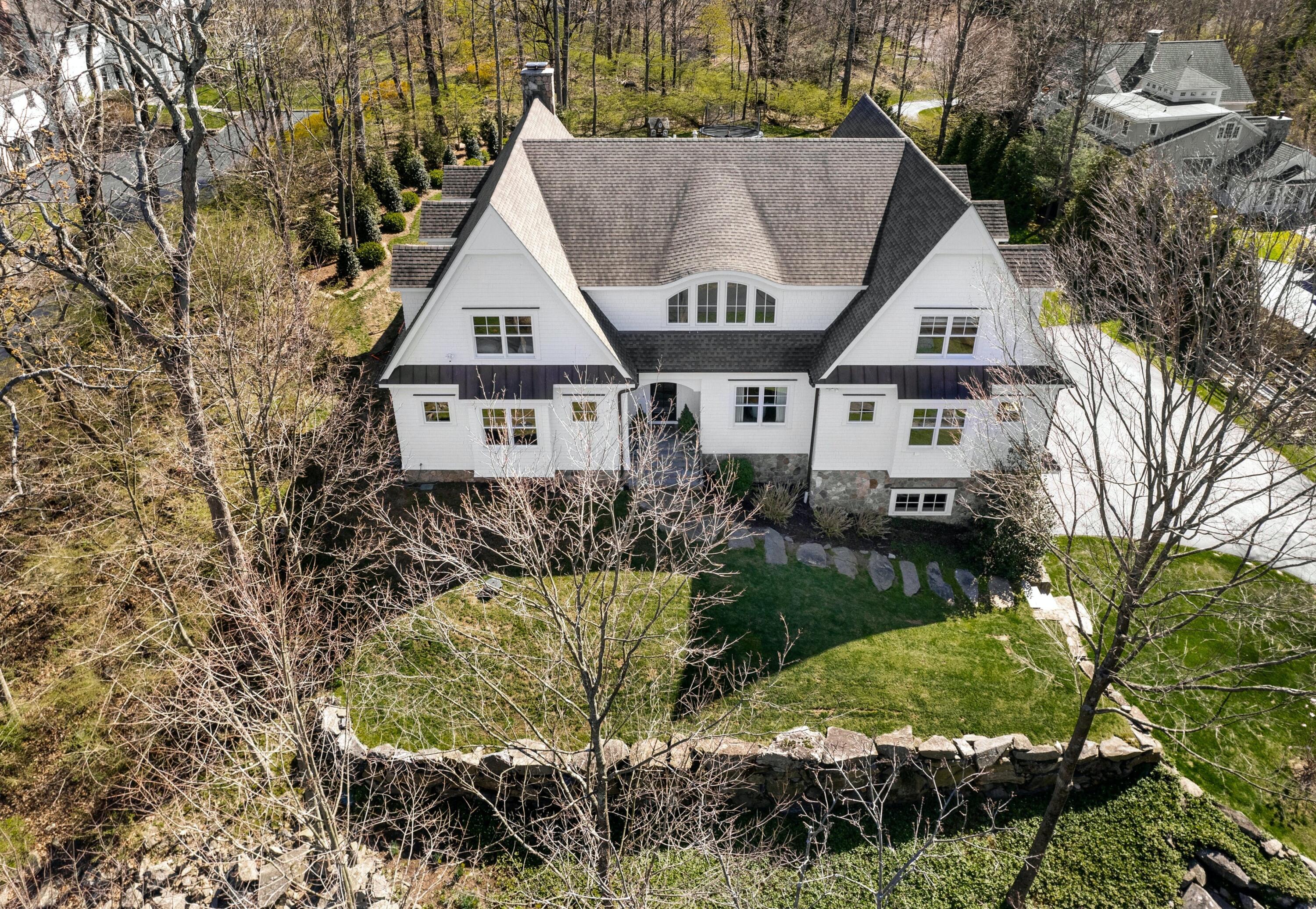 42 Delafield Island Road Darien, CT 06820 - Photo 3 of 39 a aerial view of a house next to a yard