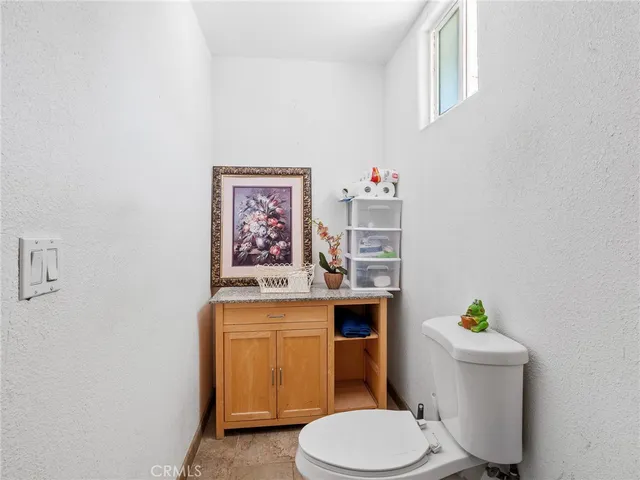 a bedroom with two beds and a window