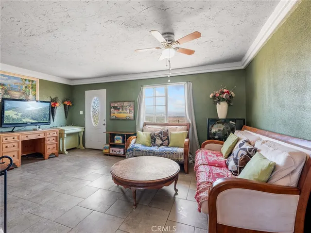 a kitchen with refrigerator and cabinets