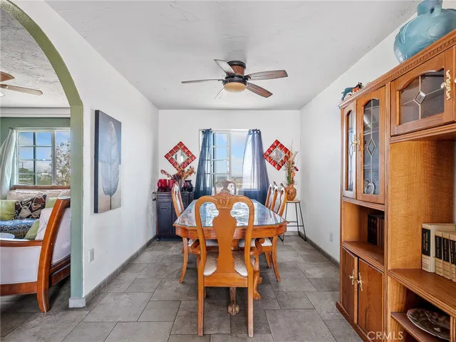 a bed room with furniture and a large window