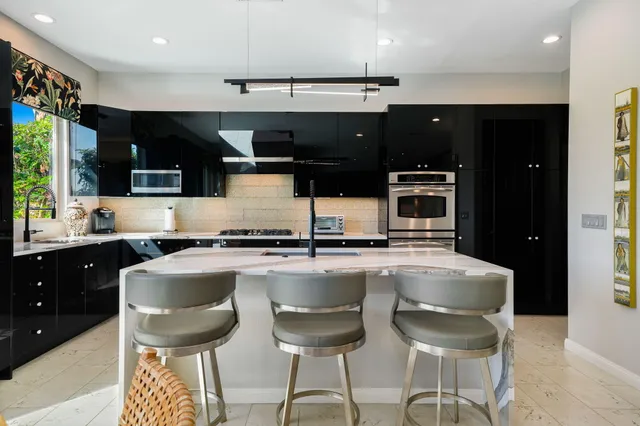 a view of a cafe with sitting area and furniture