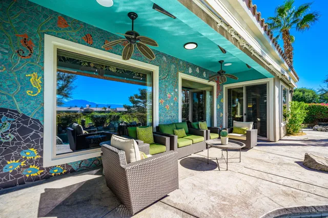 a building outdoor space with patio furniture and potted plants