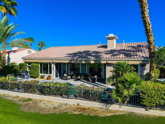 a view of a chairs and table in the patio
