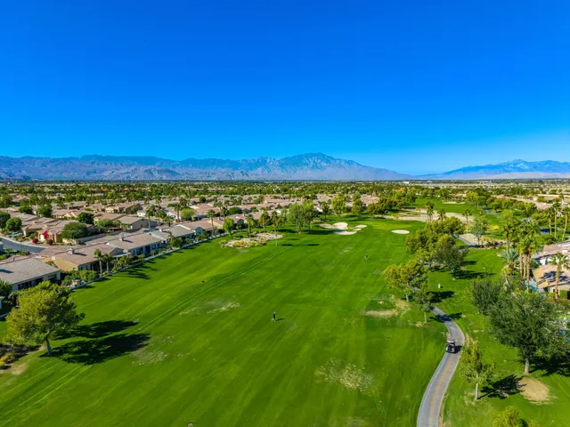 a lobby with furniture and potted plants
