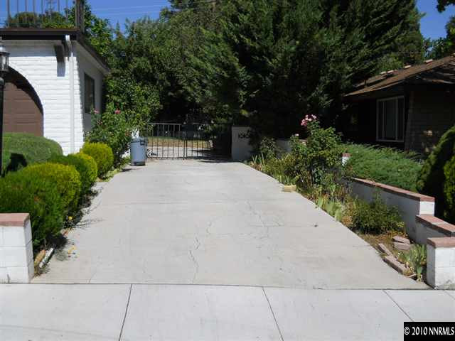 1172 Williams Avenue Reno, NV 89503 - Photo 2 of 6 a front view of a house with a garden