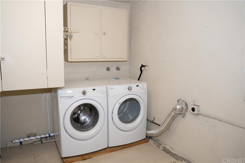 17236 Escalon Drive Encino, CA 91436 - Photo 12 of 12 a utility room with dryer and washer