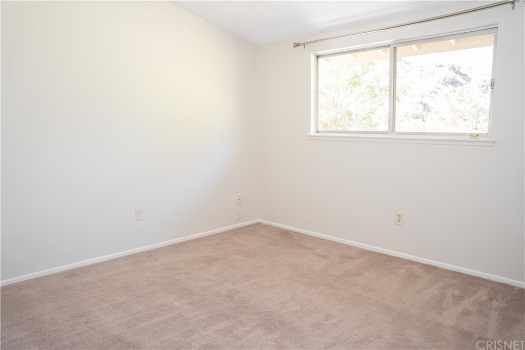 17236 Escalon Drive Encino, CA 91436 - Photo 8 of 12 an empty room with a window