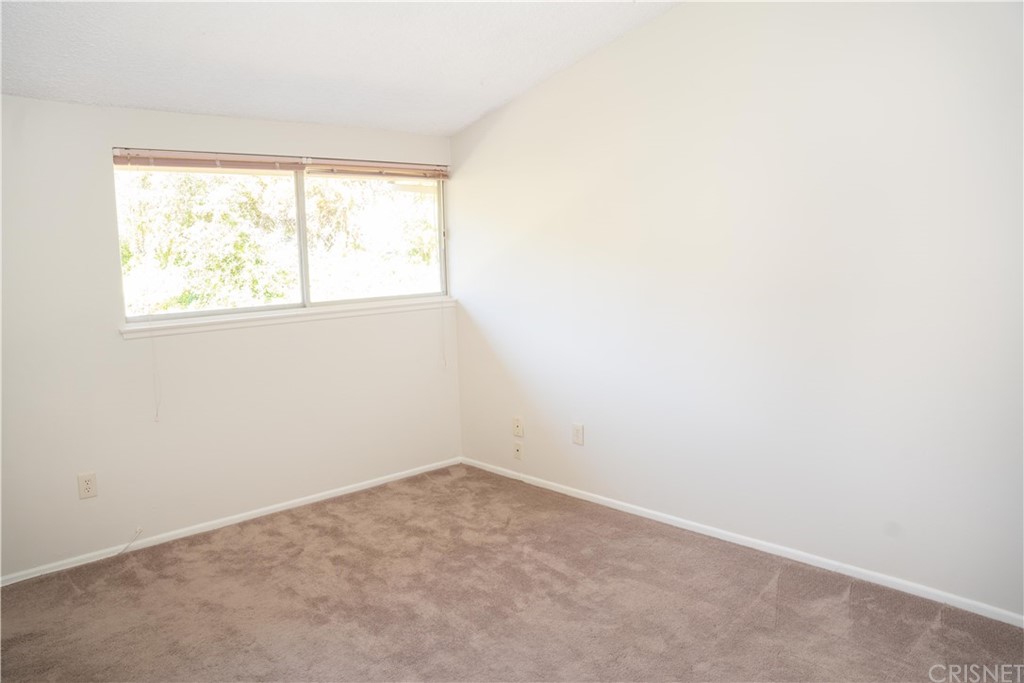 17236 Escalon Drive Encino, CA 91436 - Photo 9 of 12 an empty room with a window