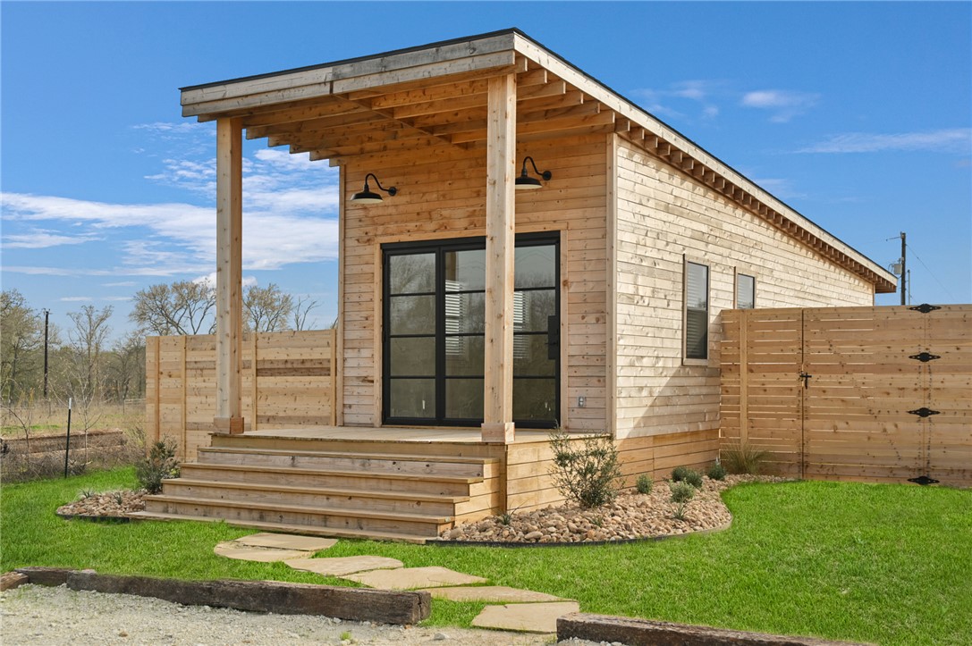 23900 Highway 6 Navasota, TX 77868 - Photo 17 of 22 a front view of a house with a yard