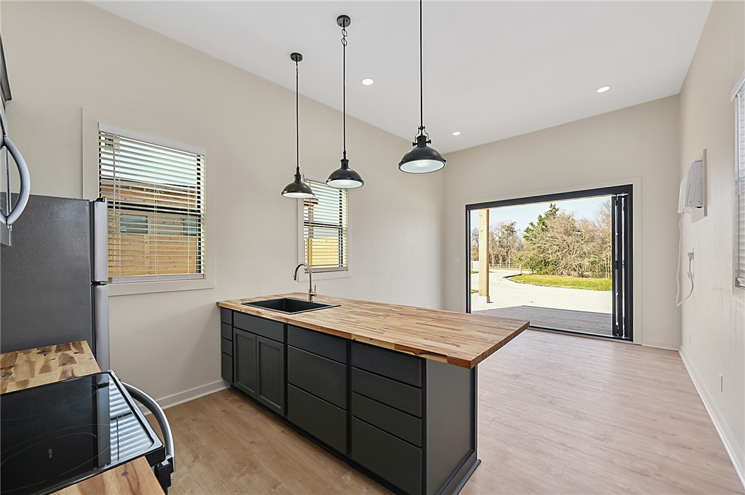 23900 Highway 6 Navasota, TX 77868 - Photo 7 of 22 a kitchen with a stove a sink and a window