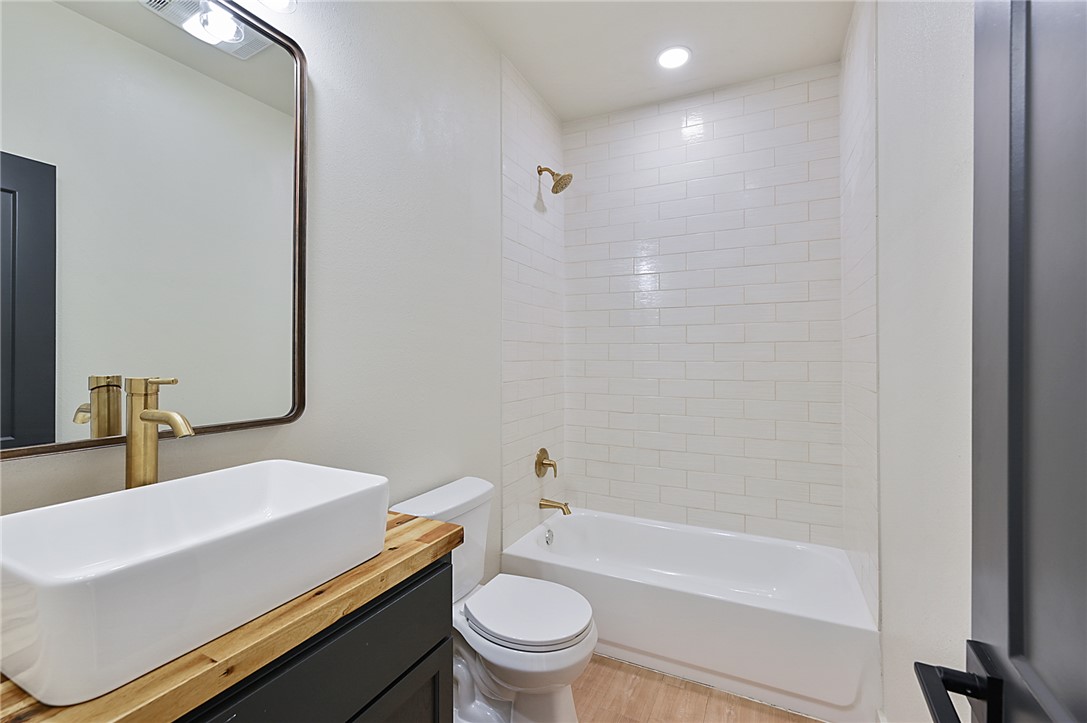 23900 Highway 6 Navasota, TX 77868 - Photo 9 of 22 a bathroom with a sink a toilet and shower