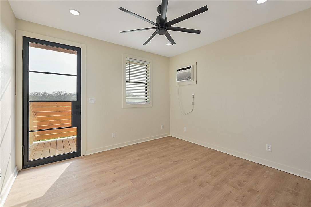 23900 Highway 6 Navasota, TX 77868 - Photo 10 of 22 an empty room with windows and fan