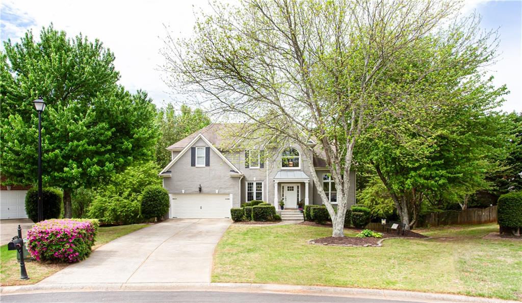 2980 Old Church Road Cumming, GA 30041 - Photo 1 of 1 a front view of a house with a yard