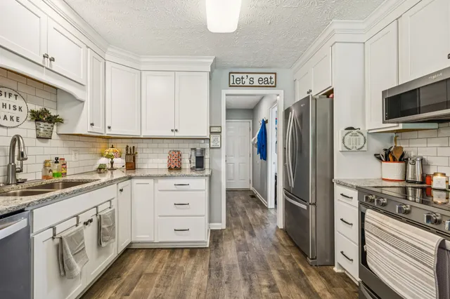 a bathroom with a sink toilet vanity and shower
