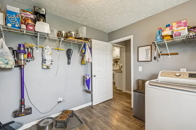 a bedroom with furniture and a chandelier