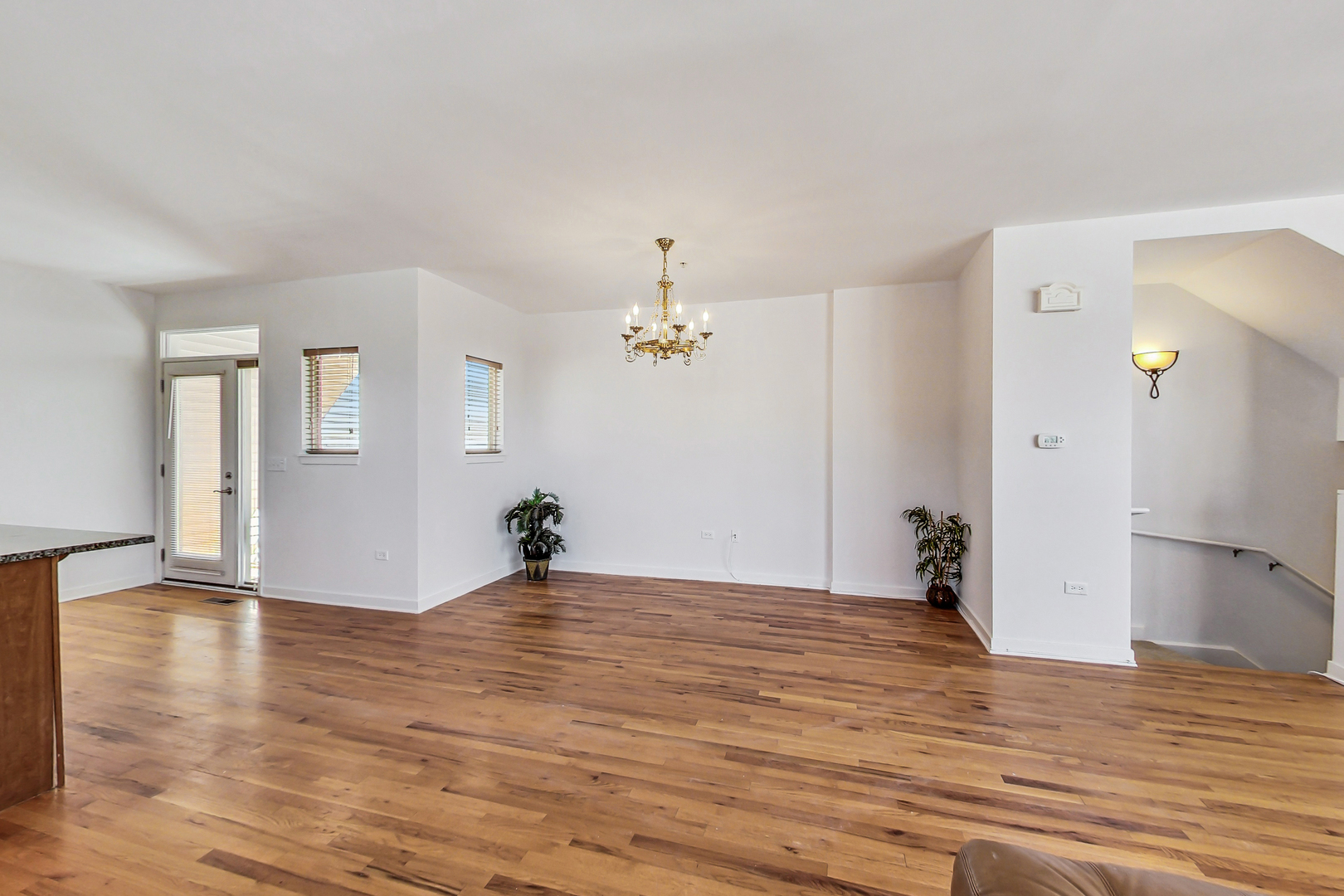 45 East 23rd Street Chicago, IL 60616 - Photo 7 of 27 a view of a livingroom with wooden floor and a ceiling fan