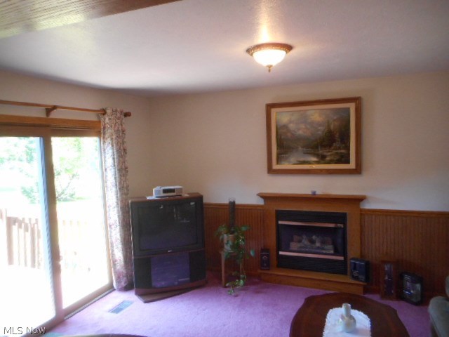 8560 Royal Ridge Drive Parma, OH 44129 - Photo 14 of 21 This Family Room offers a gas fireplace and sliding door leading to a large wood deck.