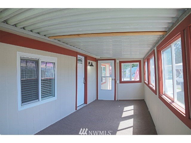 2500 South 370th Street, Unit 12 Federal Way, WA 98003 - Photo 11 of 40 a view of an empty room with wooden floor and a window