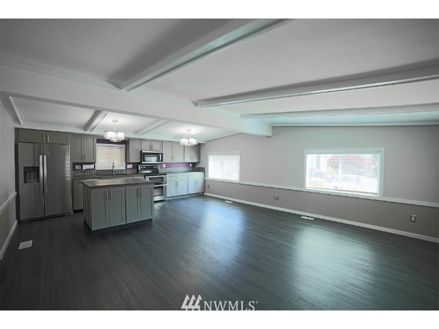 2500 South 370th Street, Unit 12 Federal Way, WA 98003 - Photo 13 of 40 a kitchen with stainless steel appliances a refrigerator and a stove top oven