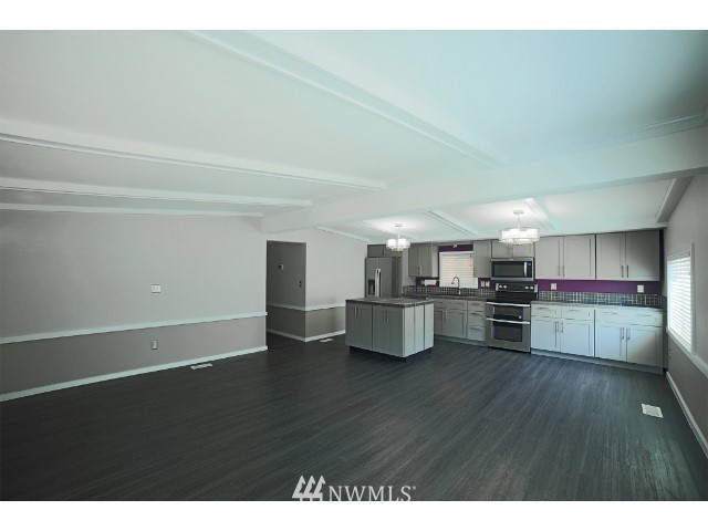 2500 South 370th Street, Unit 12 Federal Way, WA 98003 - Photo 14 of 40 a view of kitchen and dining room with wooden floor
