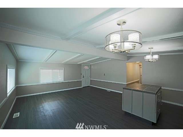 2500 South 370th Street, Unit 12 Federal Way, WA 98003 - Photo 18 of 40 a view of empty room with wooden floor