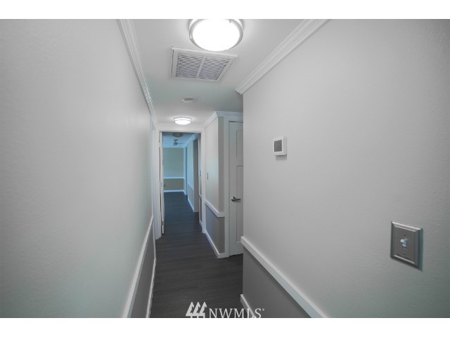 2500 South 370th Street, Unit 12 Federal Way, WA 98003 - Photo 19 of 40 a view of a hallway with wooden floor
