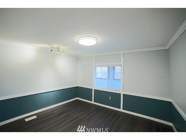 2500 South 370th Street, Unit 12 Federal Way, WA 98003 - Photo 22 of 40 a view of empty room with wooden floor