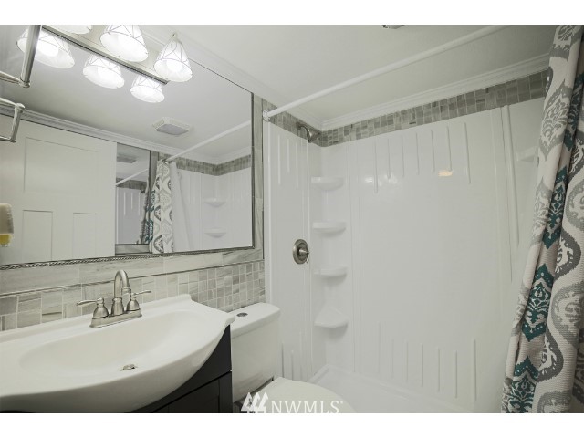 2500 South 370th Street, Unit 12 Federal Way, WA 98003 - Photo 24 of 40 a bathroom with a sink mirror and a shower