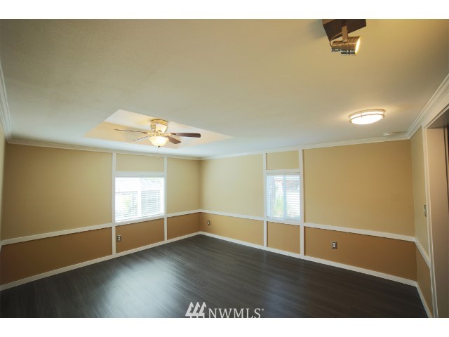 2500 South 370th Street, Unit 12 Federal Way, WA 98003 - Photo 27 of 40 a view of an empty room with wooden floor and a window