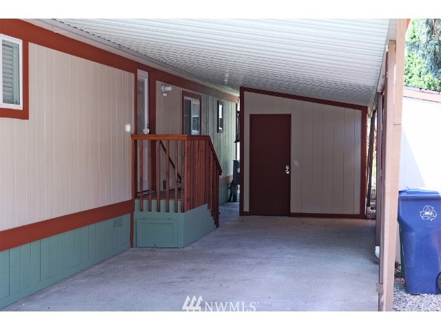 2500 South 370th Street, Unit 12 Federal Way, WA 98003 - Photo 36 of 40 a view of a hallway with wooden walls and stairs