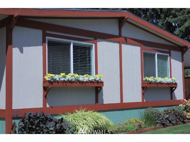 2500 South 370th Street, Unit 12 Federal Way, WA 98003 - Photo 4 of 40 a view of a house with potted plants