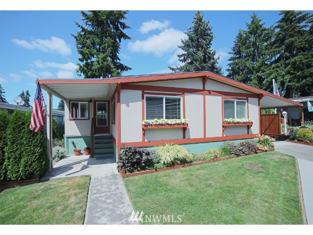 2500 South 370th Street, Unit 12 Federal Way, WA 98003 - Photo 6 of 40 a view of a house with table and chairs in a garden