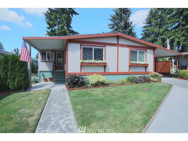 2500 South 370th Street, Unit 12 Federal Way, WA 98003 - Photo 8 of 40 a front view of a house with a yard