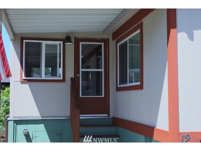 2500 South 370th Street, Unit 12 Federal Way, WA 98003 - Photo 9 of 40 a view of outdoor space and front view of a house