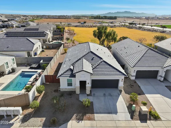 an aerial view of a house with a ocean view