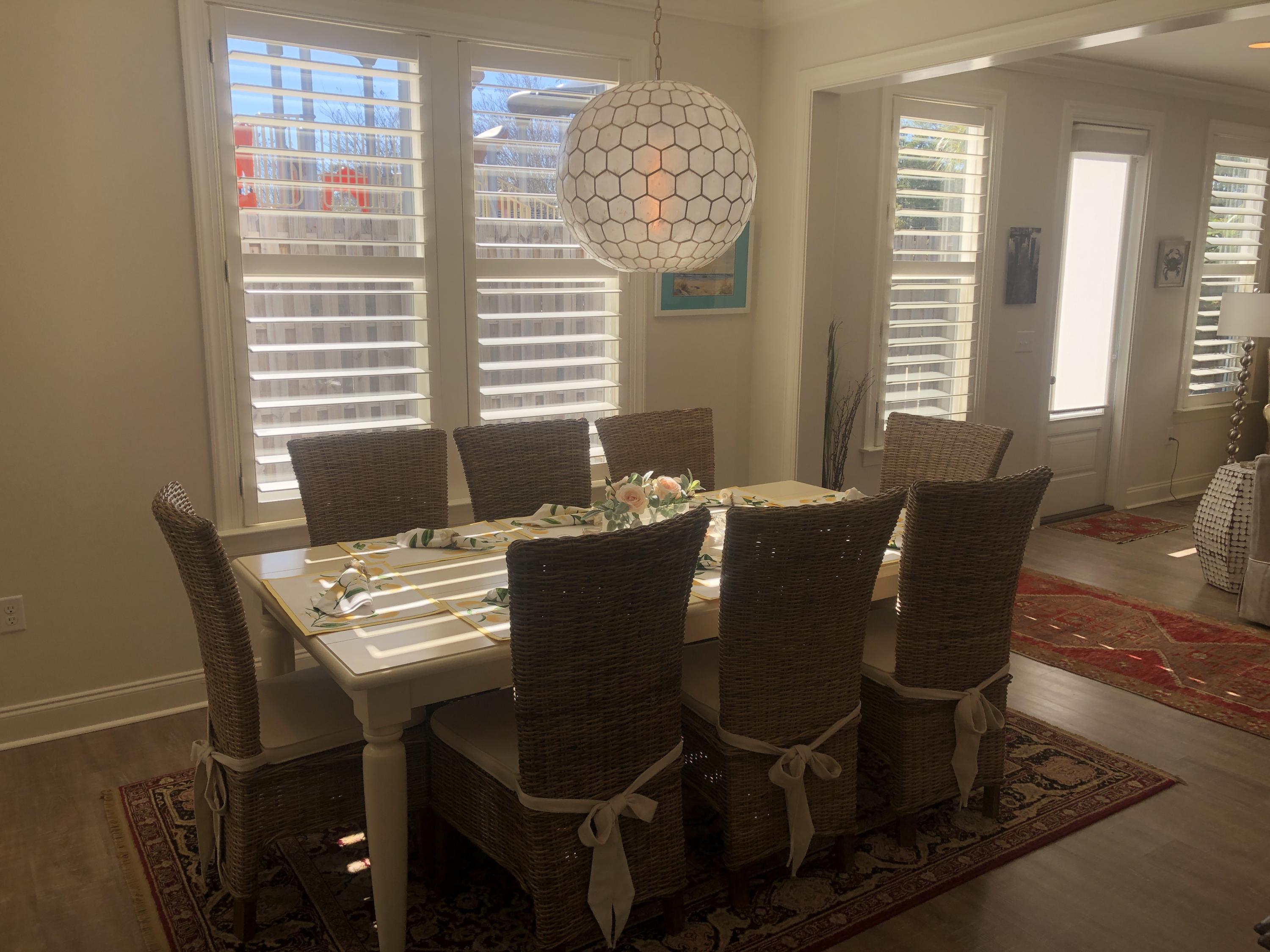 52 Chapman Street Santa Rosa Beach, FL 32459 - Photo 12 of 50 a view of a dining room with furniture and windows