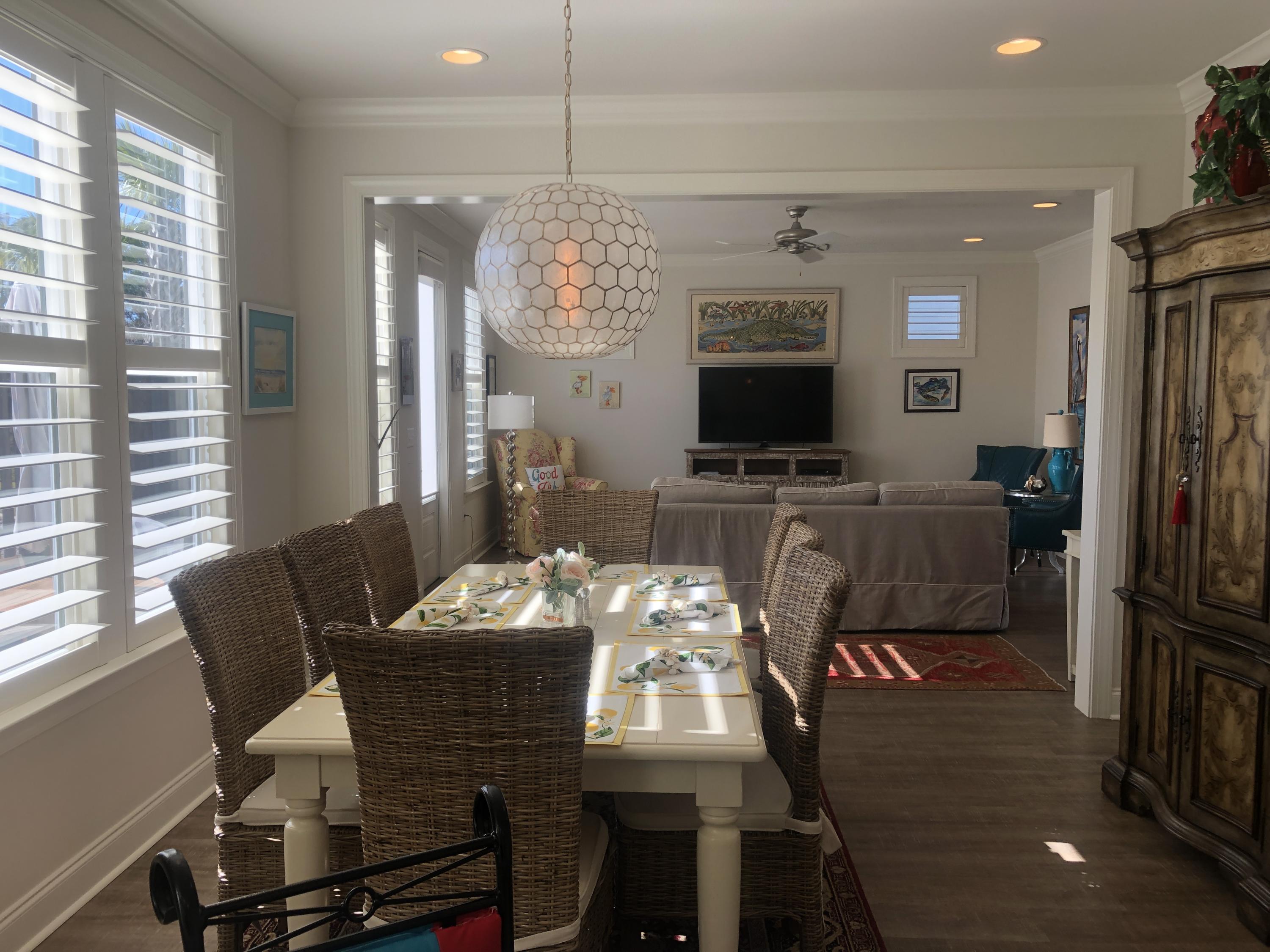 52 Chapman Street Santa Rosa Beach, FL 32459 - Photo 17 of 50 a view of a dining room with furniture and a chandelier