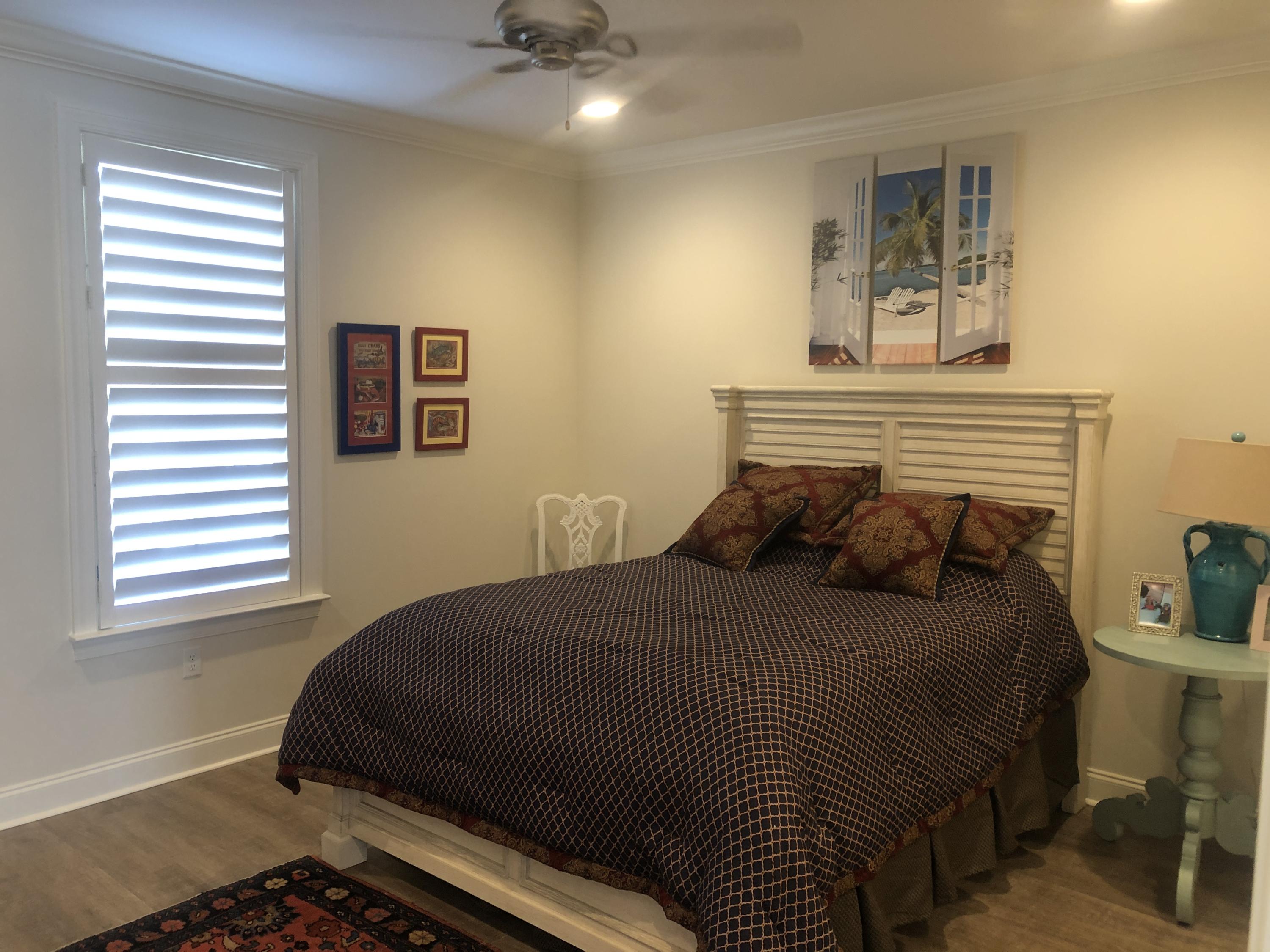 52 Chapman Street Santa Rosa Beach, FL 32459 - Photo 18 of 50 a bedroom with a bed and wooden floor