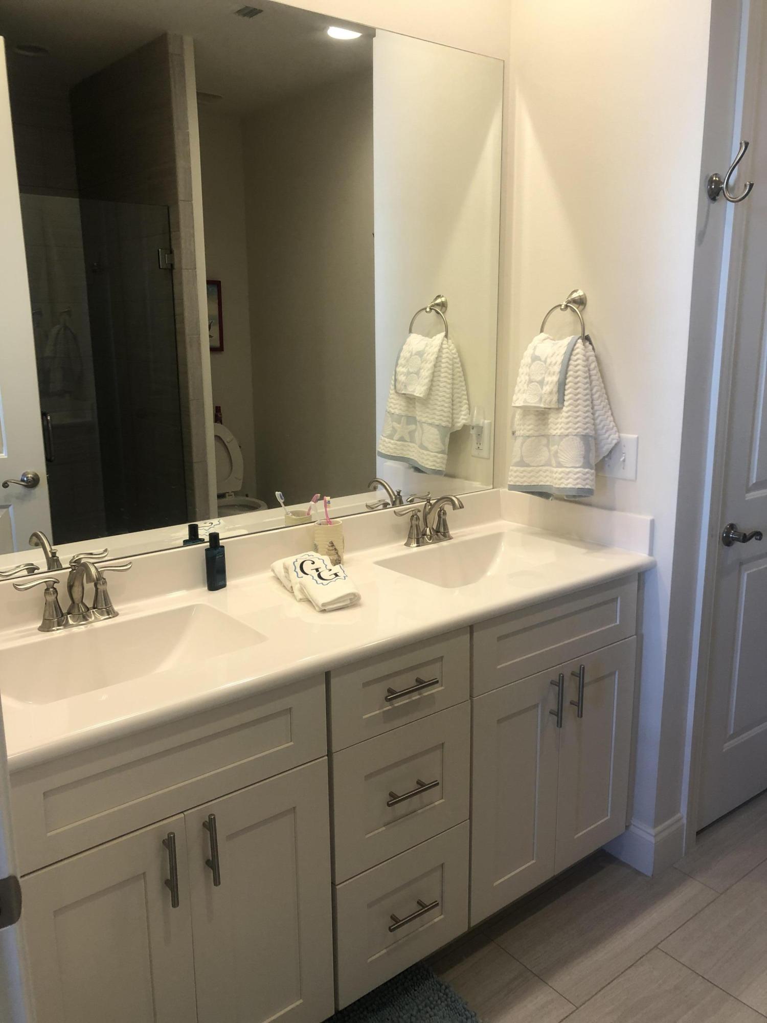 52 Chapman Street Santa Rosa Beach, FL 32459 - Photo 20 of 50 a bathroom with a double vanity sink and a mirror