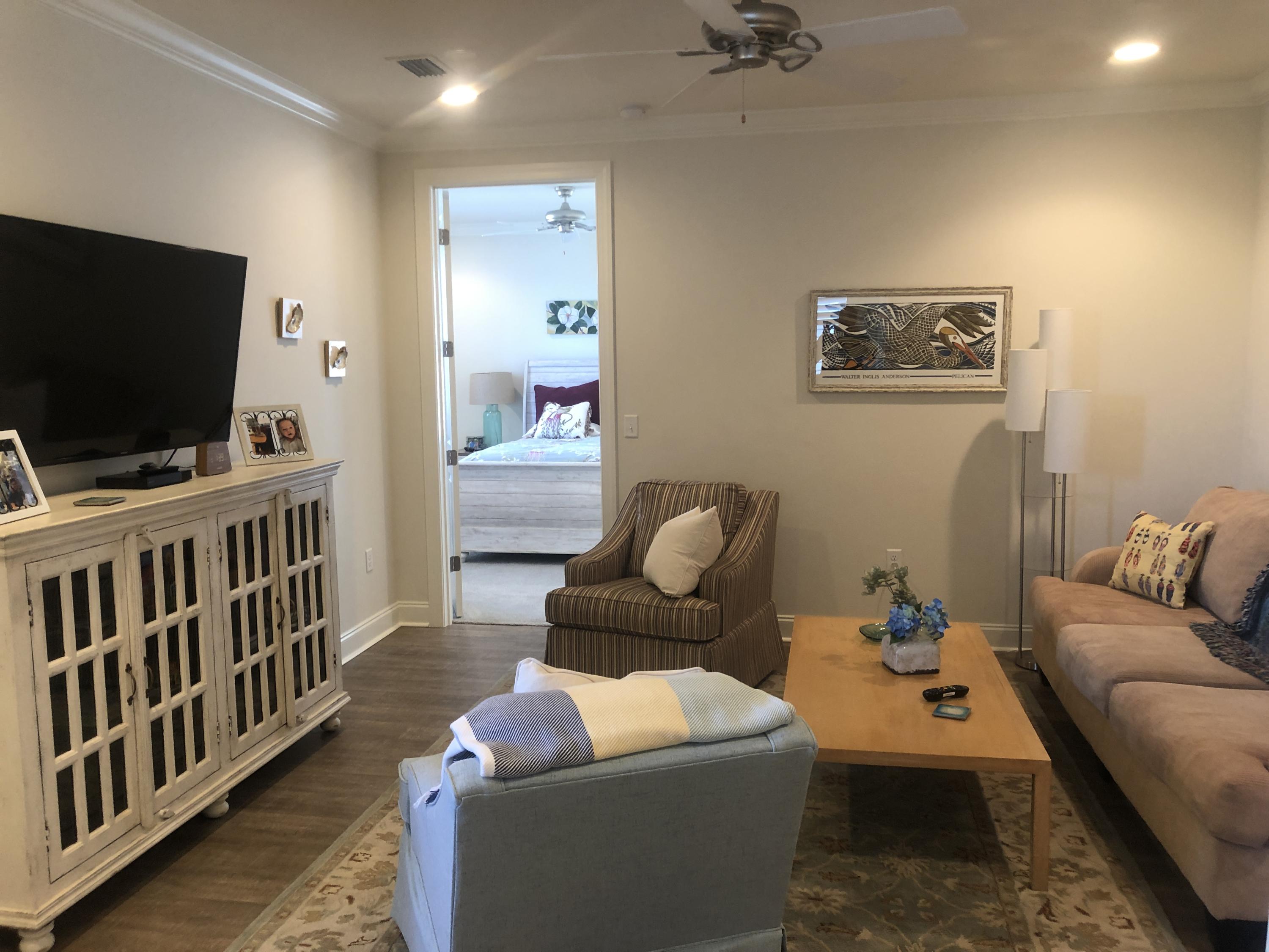 52 Chapman Street Santa Rosa Beach, FL 32459 - Photo 26 of 50 a living room with furniture and a flat screen tv