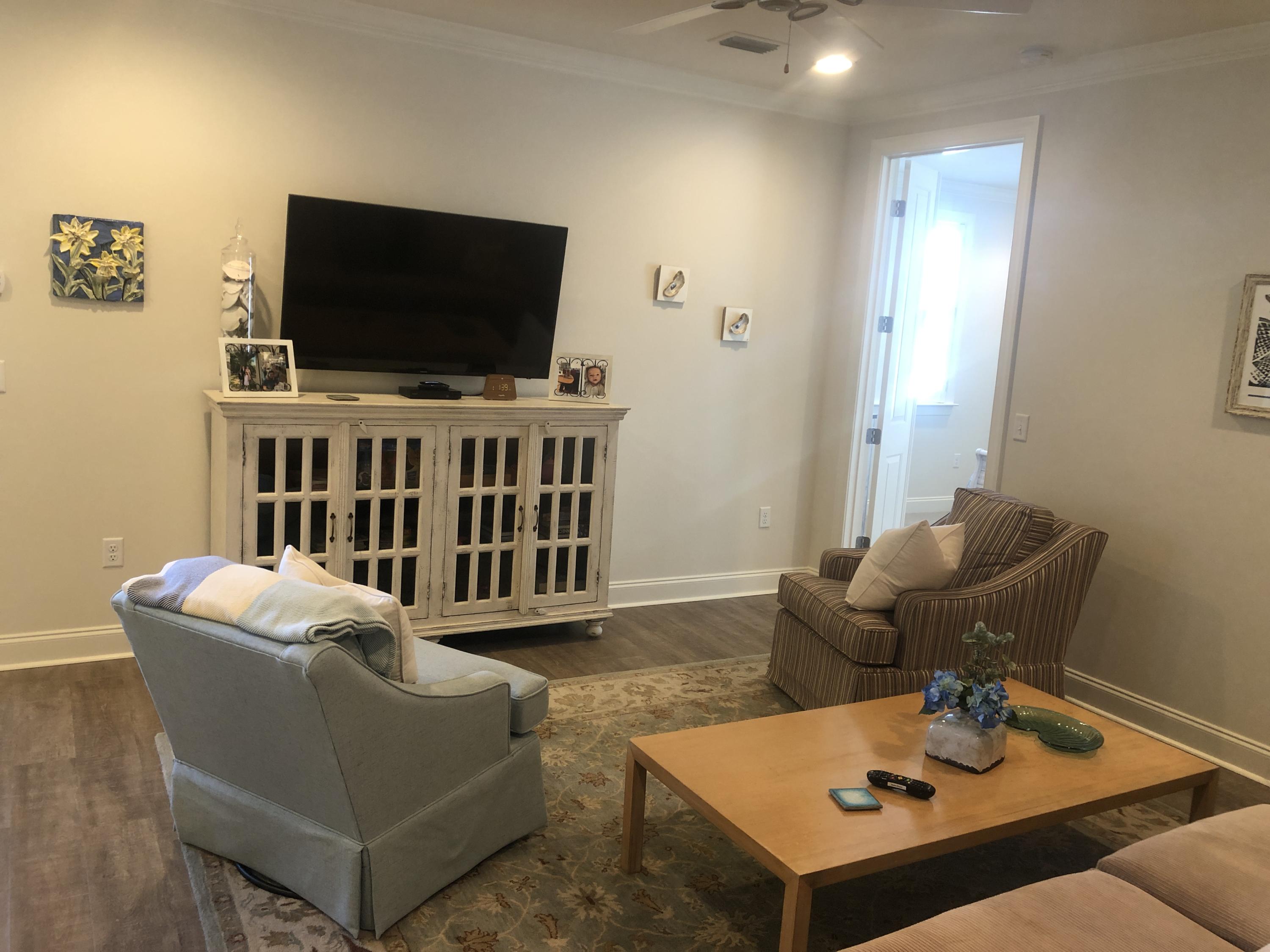 52 Chapman Street Santa Rosa Beach, FL 32459 - Photo 27 of 50 a living room with furniture and a flat screen tv